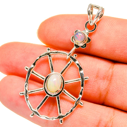 Sterling silver opal pendant with two cabochons and spoked wheel frame