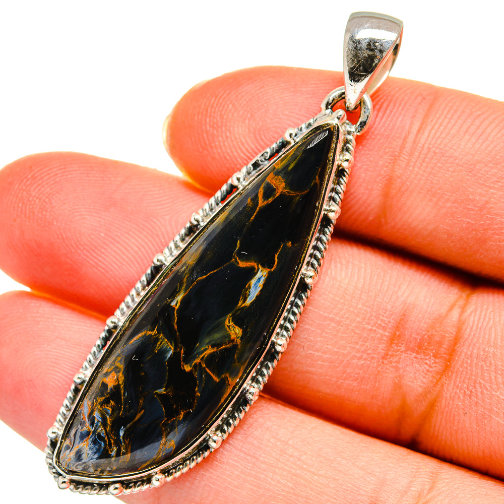 Pietersite pendant: teardrop dark stone with gold veins, silver bezel and bail