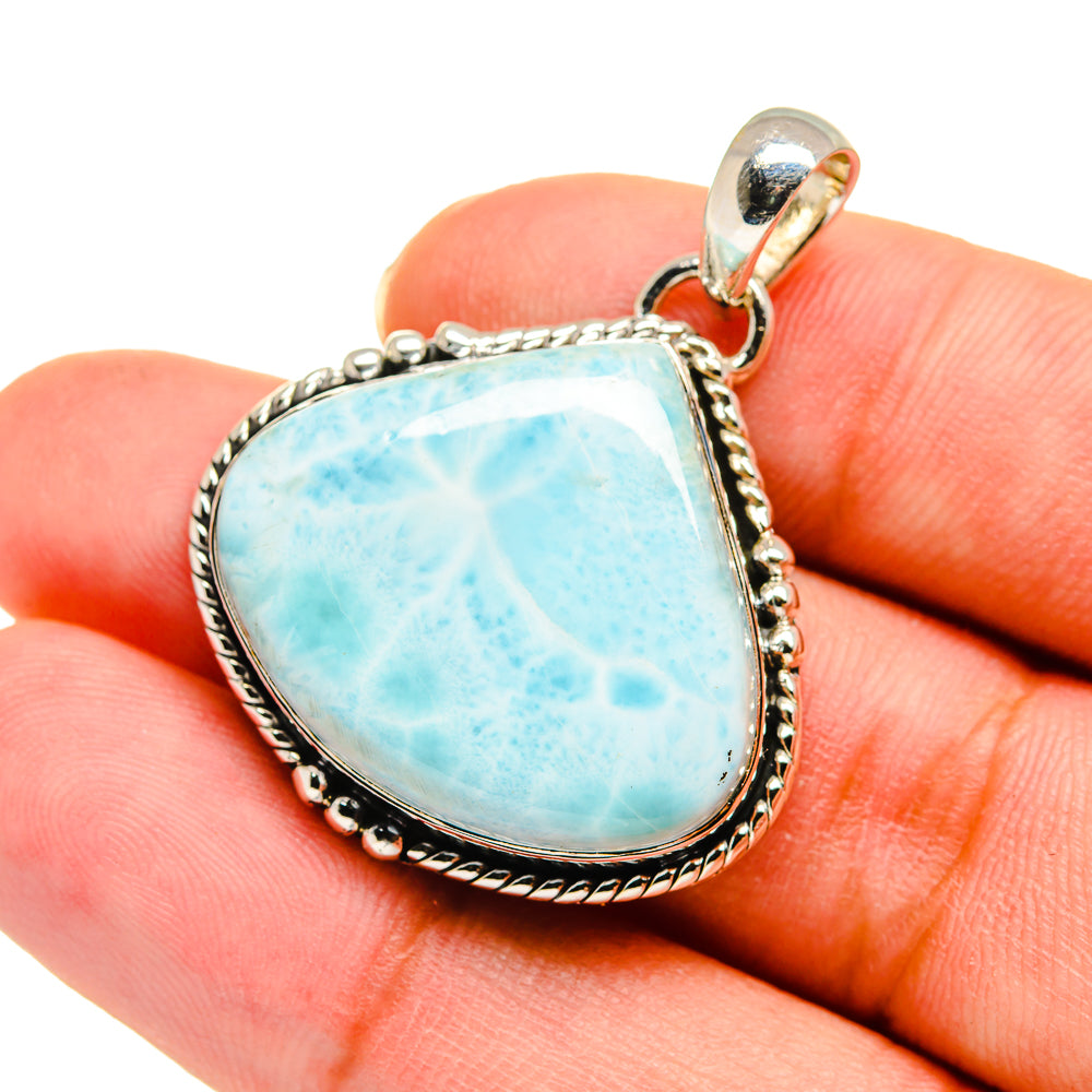 Larimar pendant in 925 sterling silver with teardrop light-blue stone and loop bail