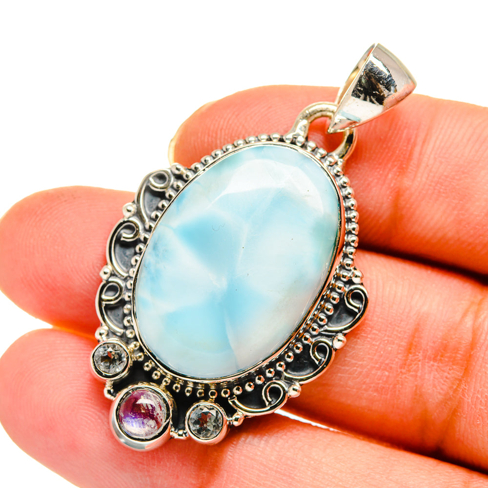 Sterling silver oval larimar pendant with light blue stone, bezel and round accent stones