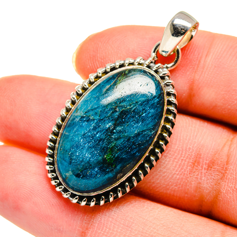 Sterling silver oval apatite pendant with faceted blue stone set in ornate bezel