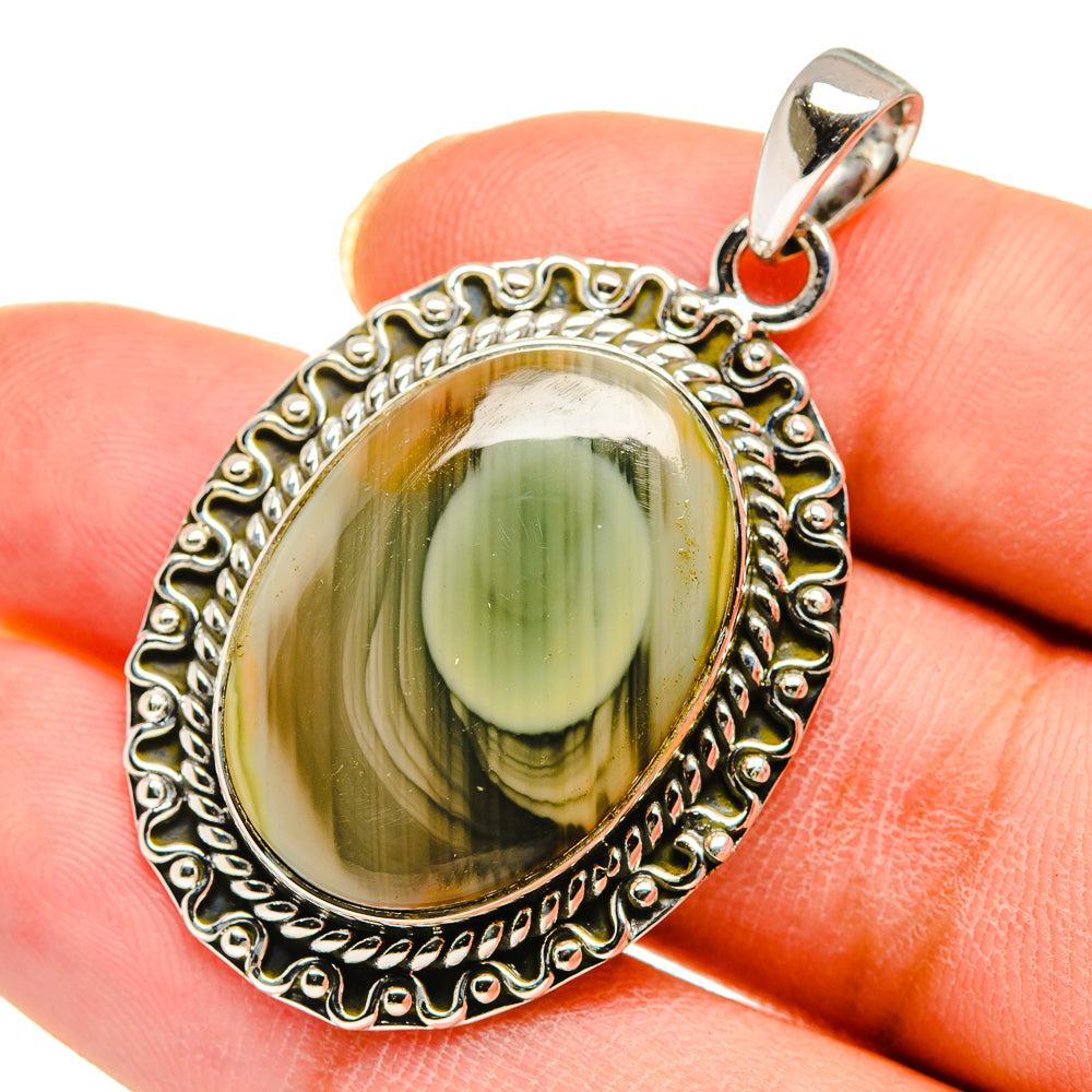 Jasper pendant in sterling silver with oval green cabochon, silver bail.