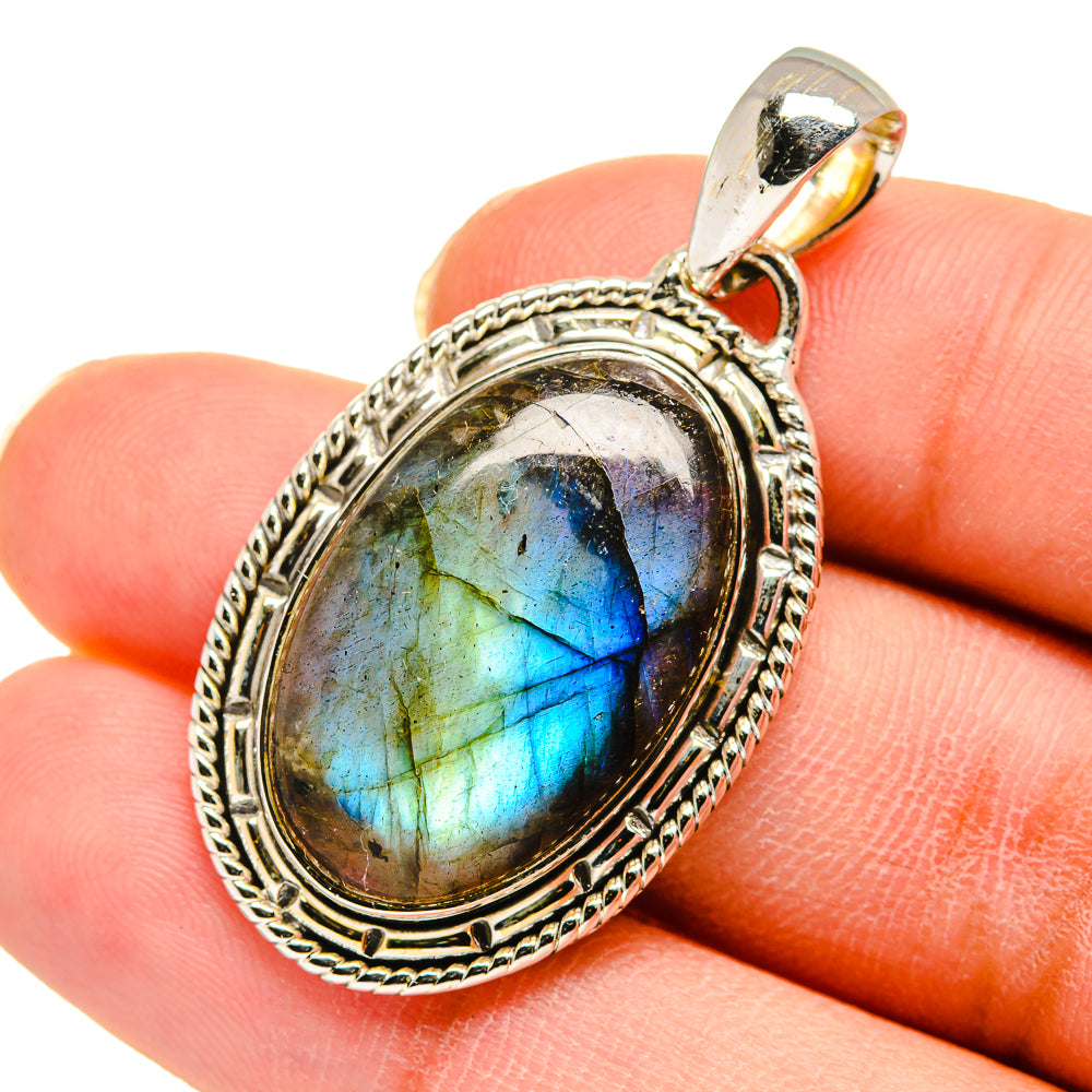 Oval labradorite pendant with blue flash in ornate 925 sterling silver frame