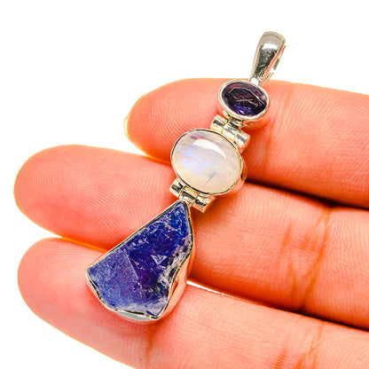 Sterling silver pendant with oval moonstone, round purple stone, and blue rough teardrop