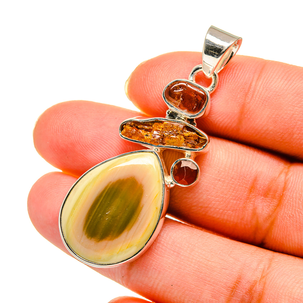 Sterling silver pendant with oval yellow stone, orange jasper piece, and red round gem