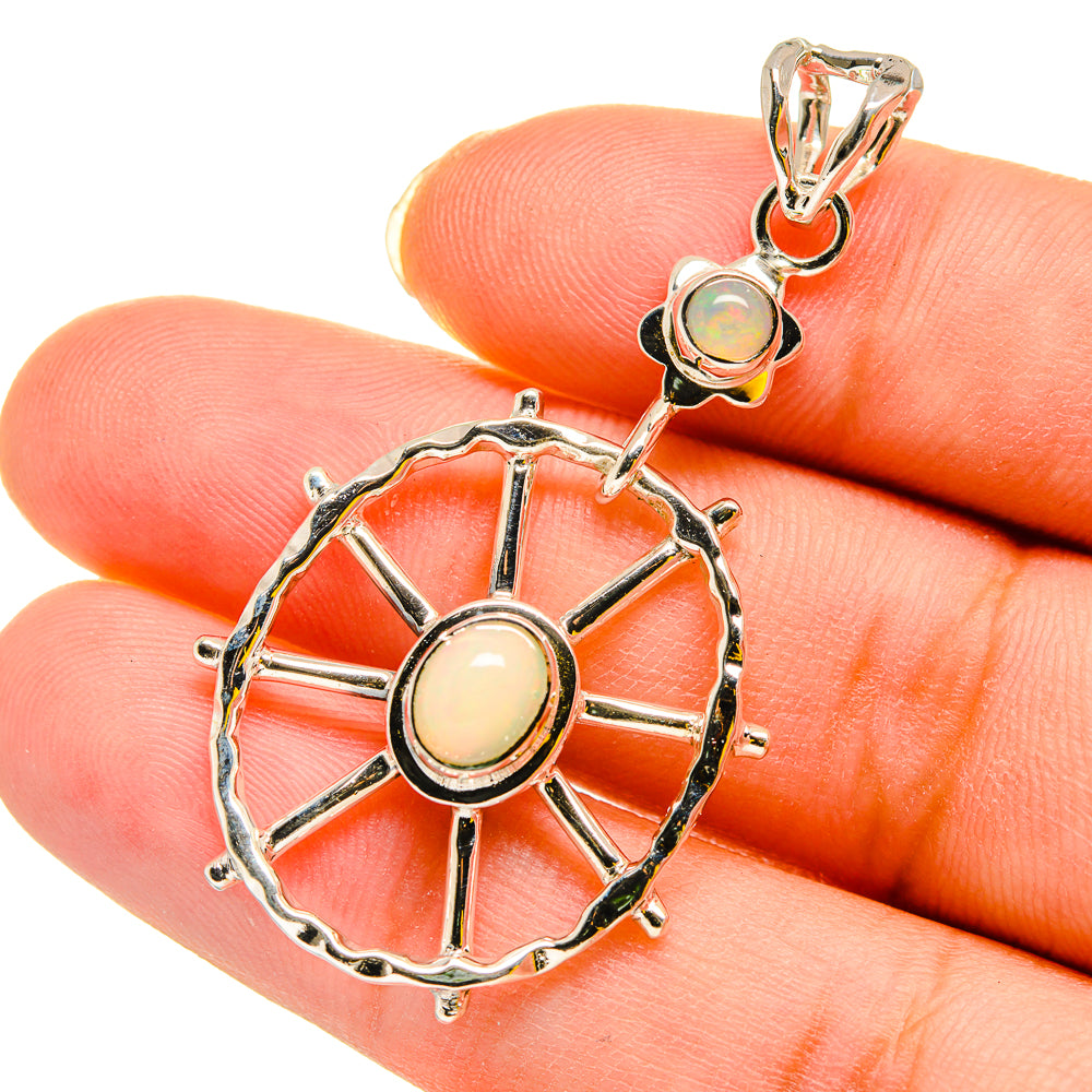 Sterling silver opal pendant with round pale opal, green opal accents, wheel spokes