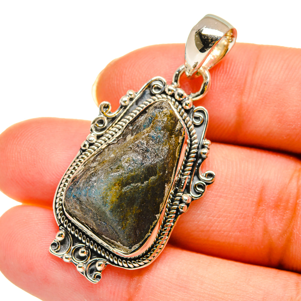 Rough labradorite pendant in sterling silver, oval faceted stone on bail