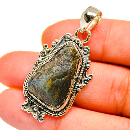 Rough labradorite pendant in sterling silver, oval faceted stone on bail