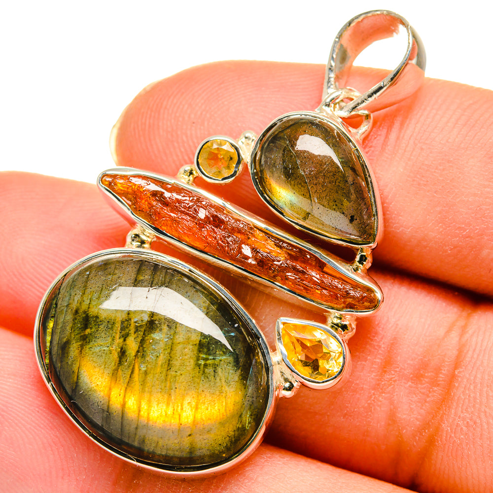 Sterling silver pendant featuring oval green-gold labradorite and orange bar with citrine rounds