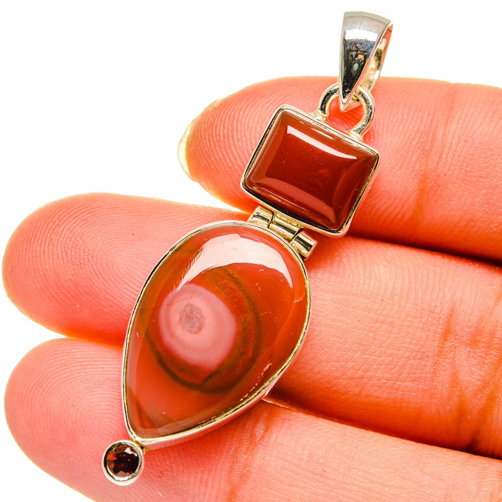 Red gemstone pendant with square and oval stones in silver frame, round red accent