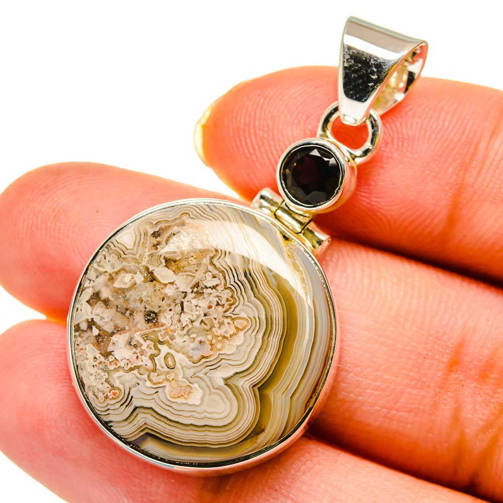 Round lace agate pendant with dark top gemstone in sterling silver setting