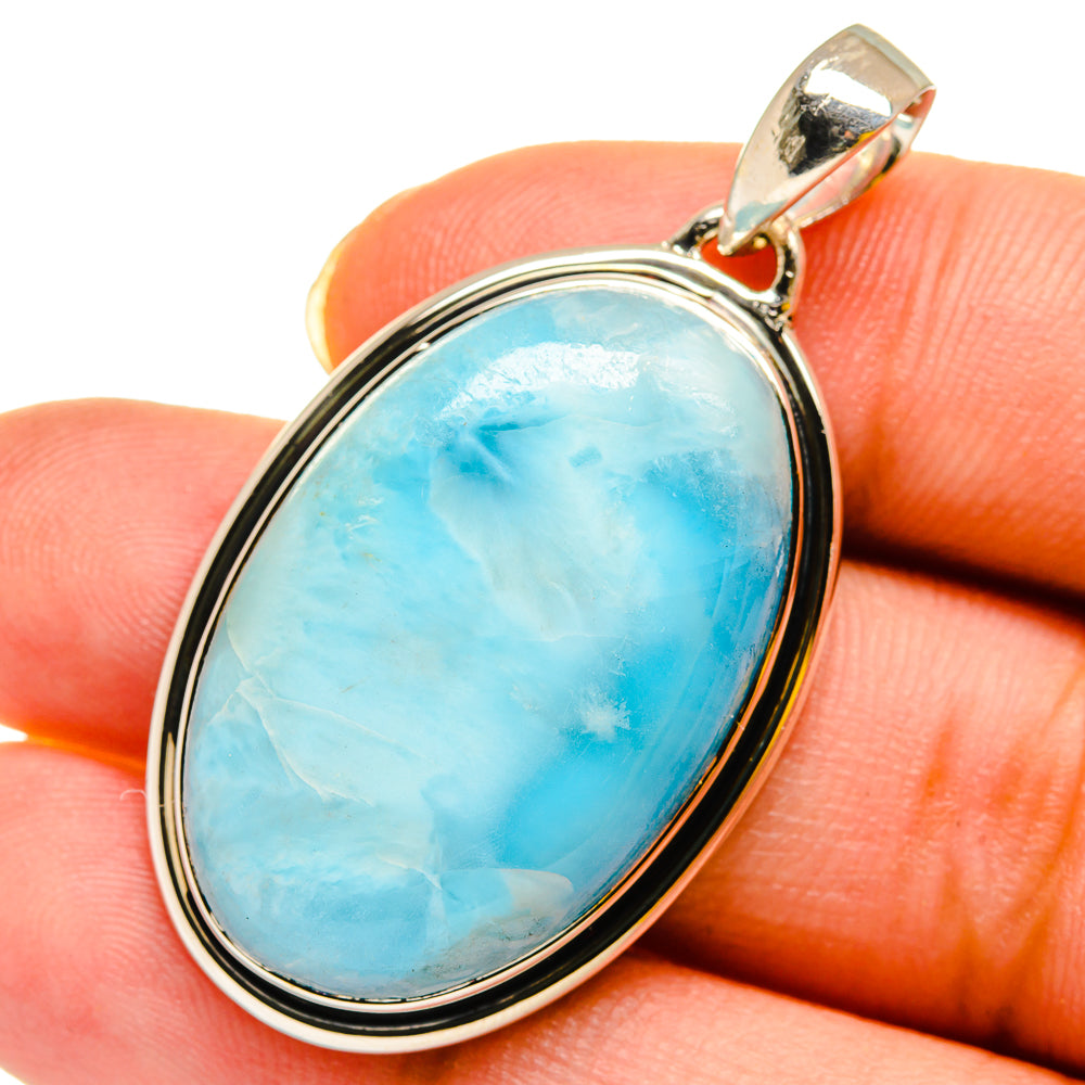 Oval larimar pendant in sterling silver bezel with top loop bail, blue gemstone.