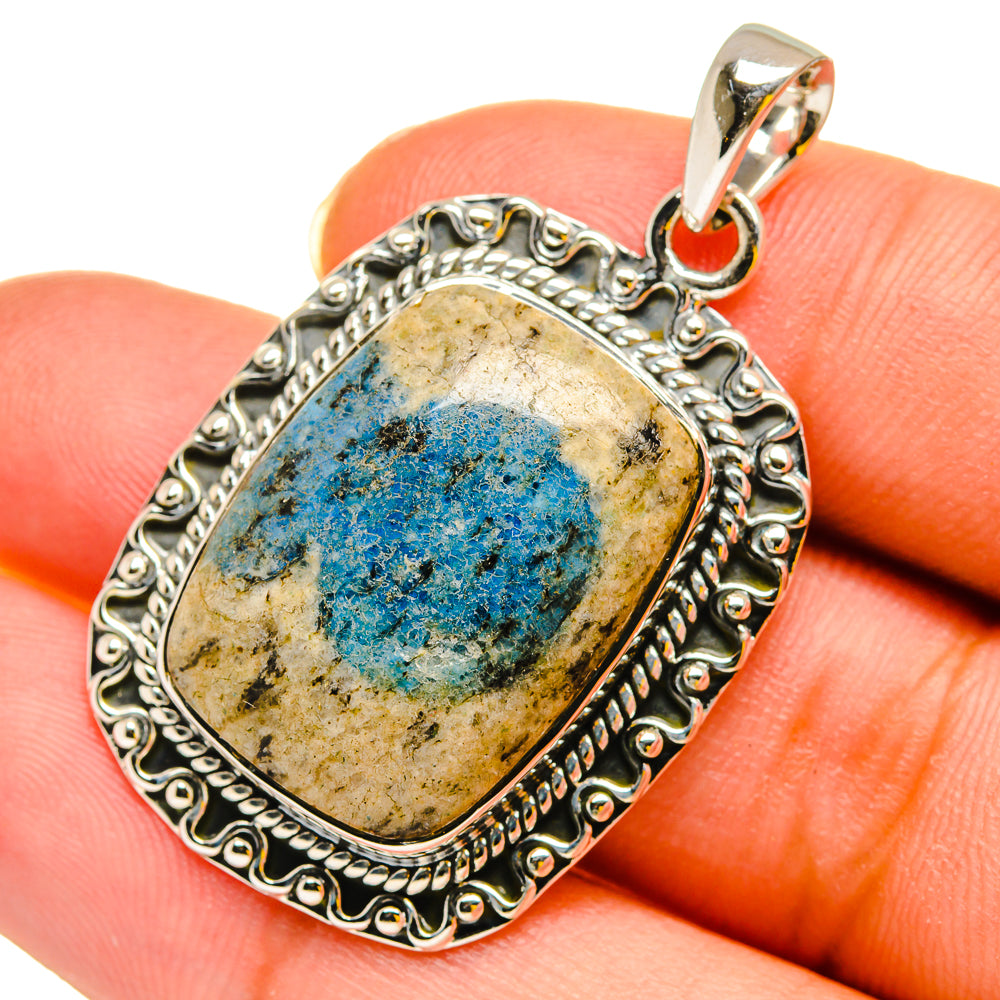 Blue azurite pendant with ornate oval sterling silver border and top loop