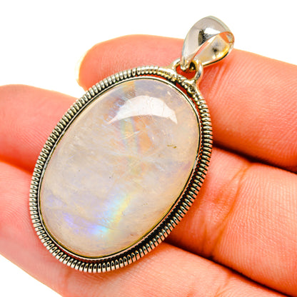 Oval moonstone pendant in 925 sterling silver with beaded bezel and clasped bail