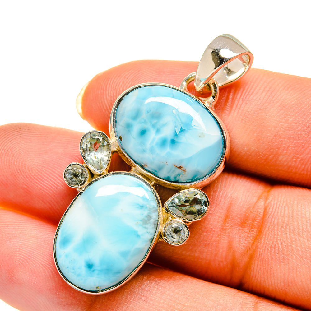 Sterling silver pendant with two oval blue cabochon stones and round crystal accents