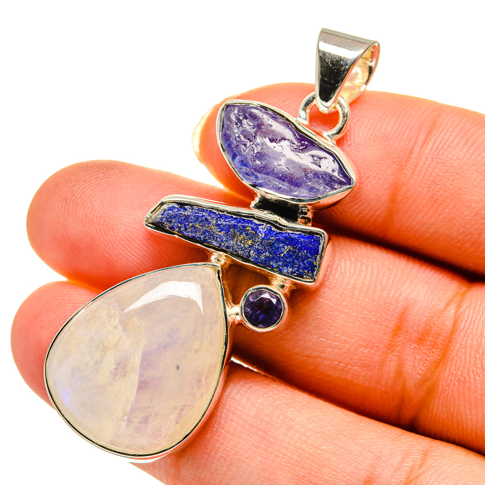 Sterling silver pendant with rainbow moonstone oval, lapis rectangle, and blue stone accents