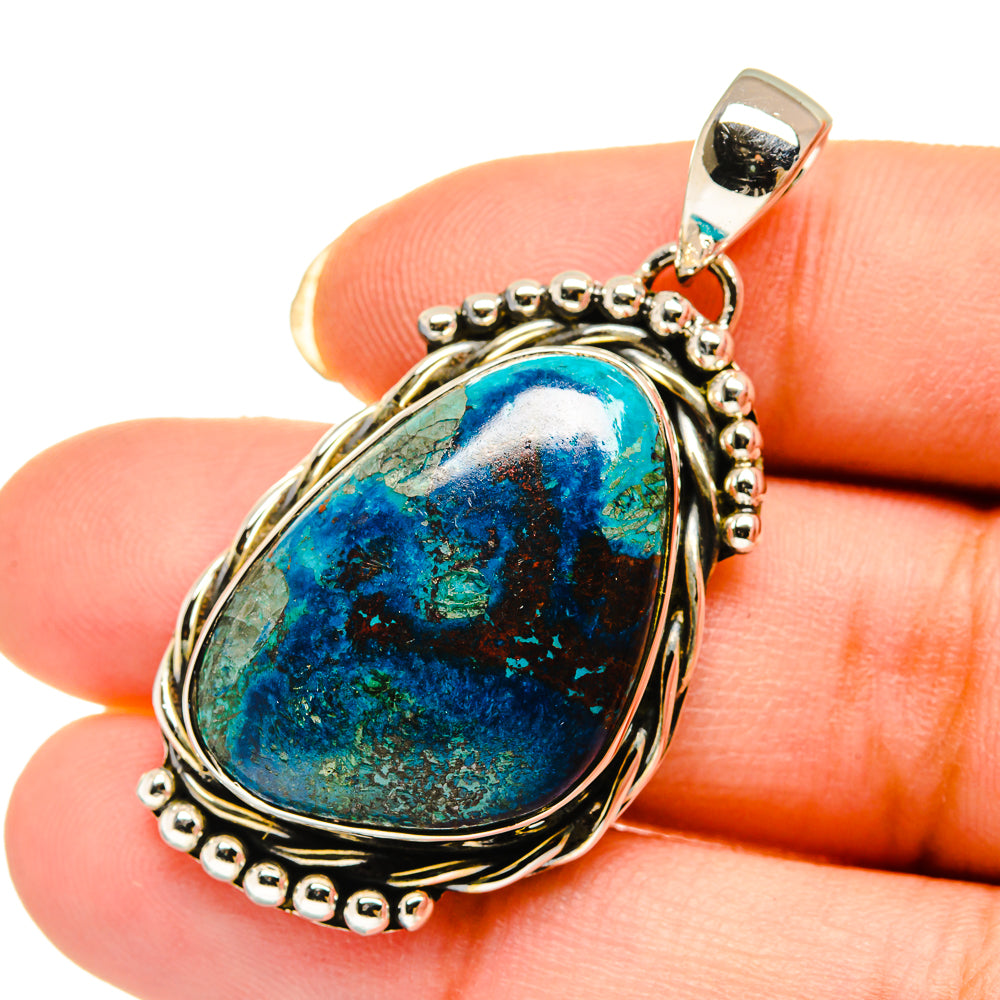 Sterling silver pendant with oval blue-green cabochon stone on chain links
