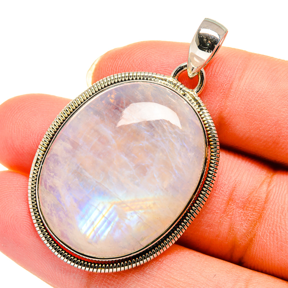 Rainbow moonstone pendant in oval bezel with round rope frame, 925 sterling silver bail
