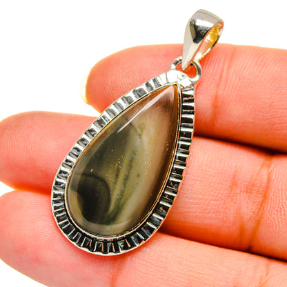 Teardrop jasper pendant in silver with scalloped bezel and top bail, green-gold stone