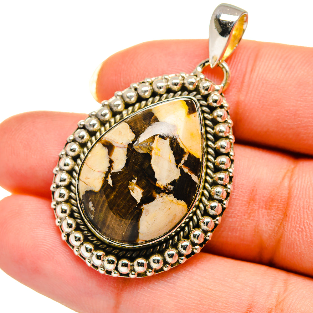 Teardrop sterling silver pendant with beaded border and peanut wood jasper cabochon
