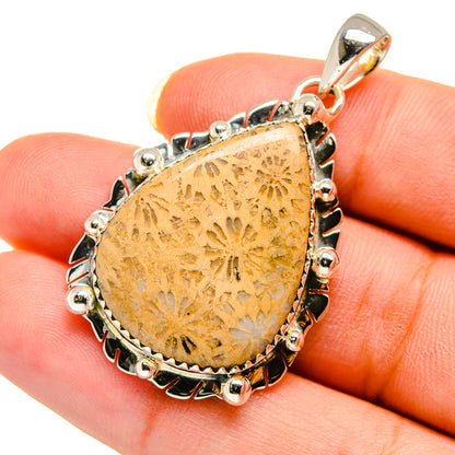 Amber coral teardrop pendant in 925 sterling silver bezel, with ornate bail