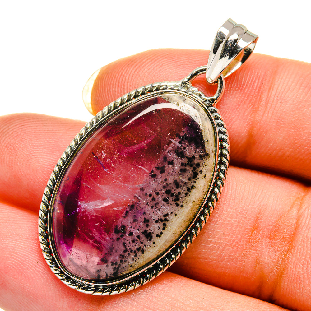 Amethyst oval cabochon pendant with marbled purple gemstone and rope-edge silver bezel