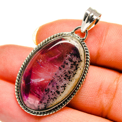 Amethyst oval cabochon pendant with marbled purple gemstone and rope-edge silver bezel