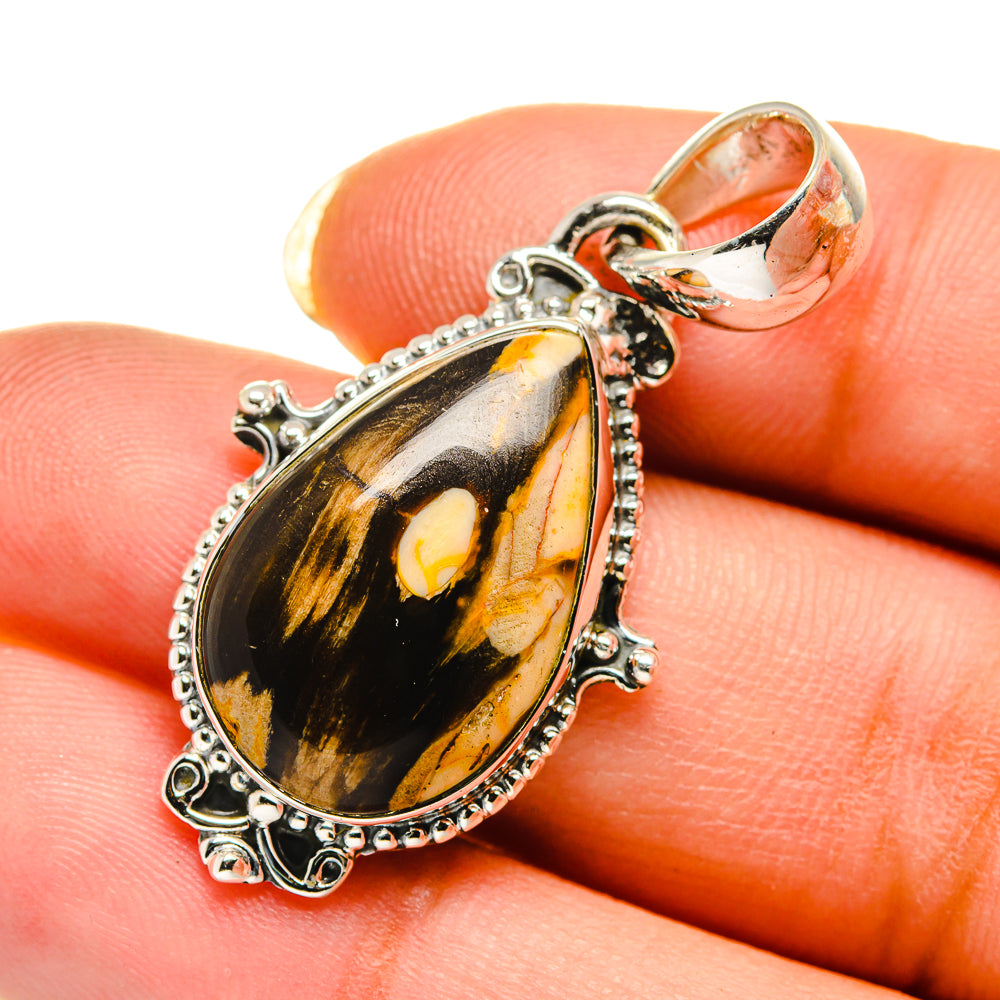 Teardrop jasper pendant in 925 sterling silver with marbled black and amber stone.