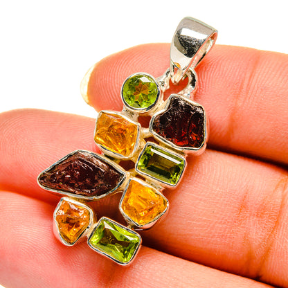 Sterling silver pendant with rough green, amber, and red gemstones, loop bail