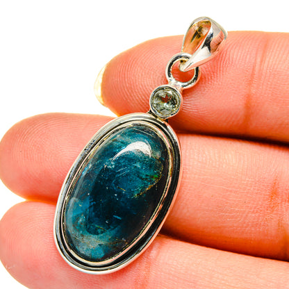 Sterling silver oval blue stone pendant with small round accent stones