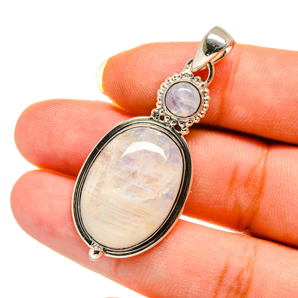 Oval moonstone pendant in blackened sterling silver with ornate bezel and bail