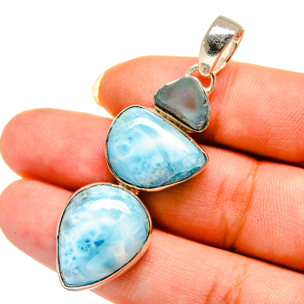 Sterling silver pendant with three blue teardrop gemstones and bail
