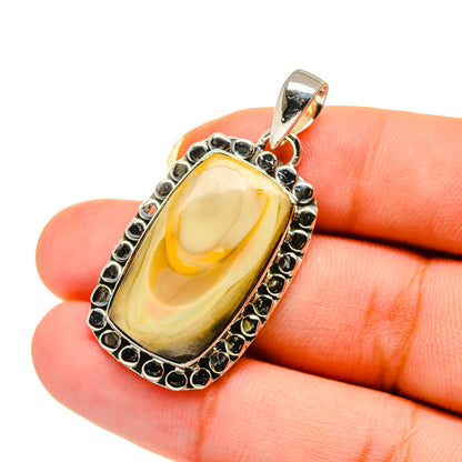 Oval jasper pendant in 925 sterling silver with yellow stone and black accents