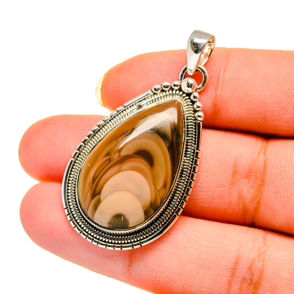 Teardrop sterling silver pendant with brown and gold mottled jasper stone, bail visible