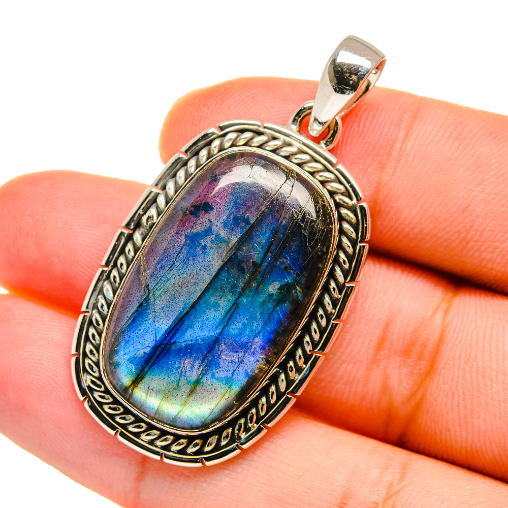 Sterling silver oval labradorite pendant, blue and purple flash cabochon on bail.