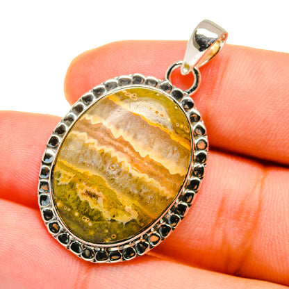 Sterling silver oval pendant with ocean jasper cabochon, yellow-green wavy bands