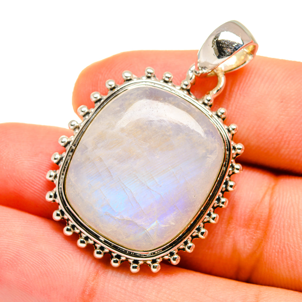 Opalescent oval moonstone pendant on sterling silver with detailed beaded edge and bail