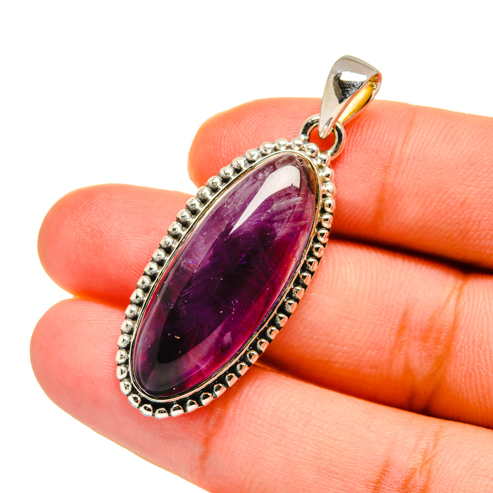 Amethyst pendant with oval amethyst cabochon, silver beaded frame and top bail