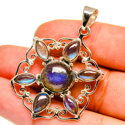 Sterling silver pendant detail with blue-purple labradorite stones and bail loop