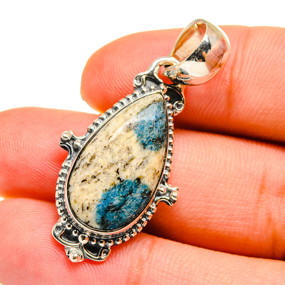 Sterling silver azurite pendant close-up with teardrop blue stone and raised settings