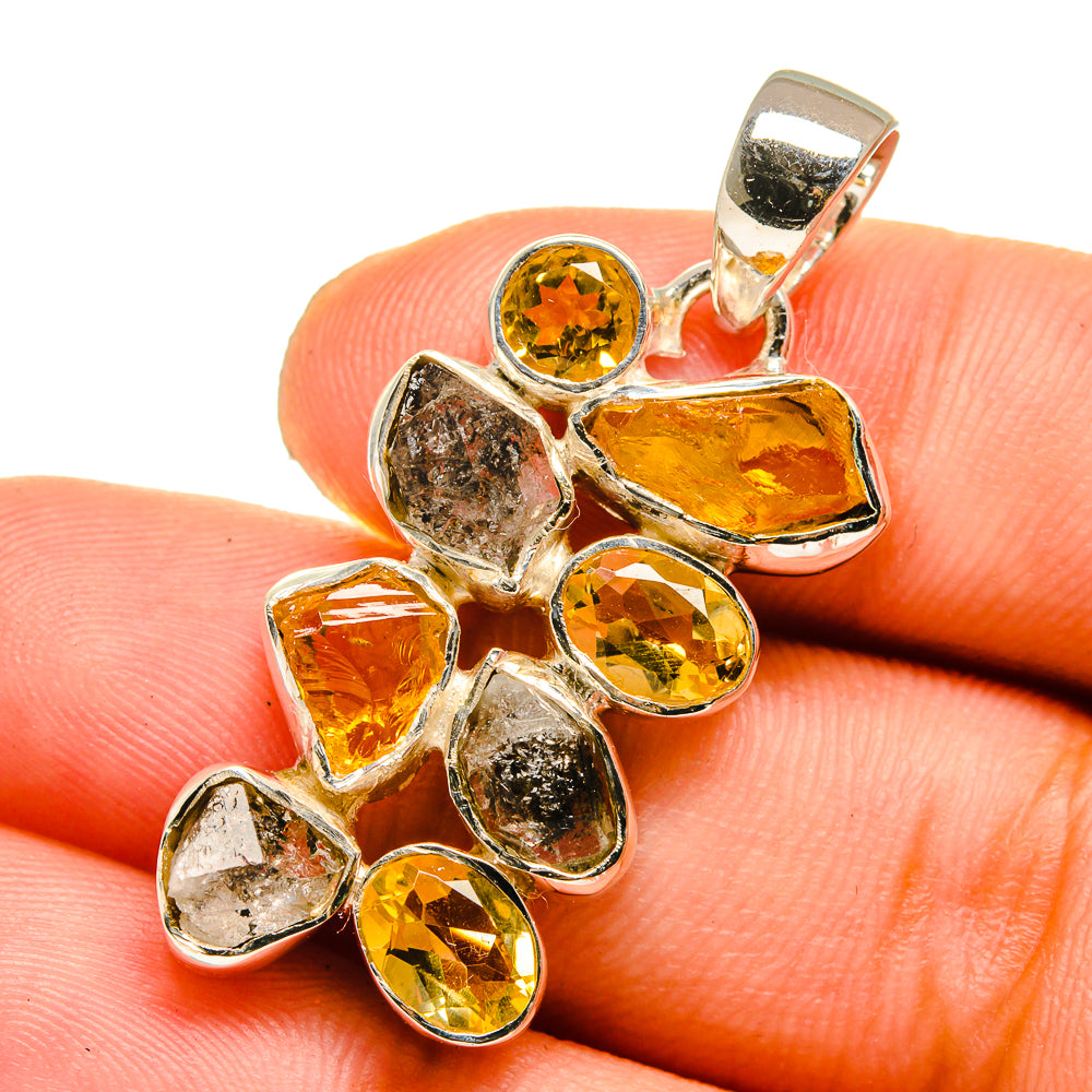 Sterling silver citrine pendant with rough and faceted yellow stones, top bail