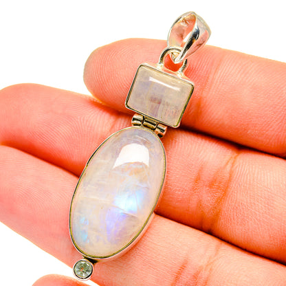Sterling silver pendant with square bail, oval opalescent moonstone, and small round gemstone