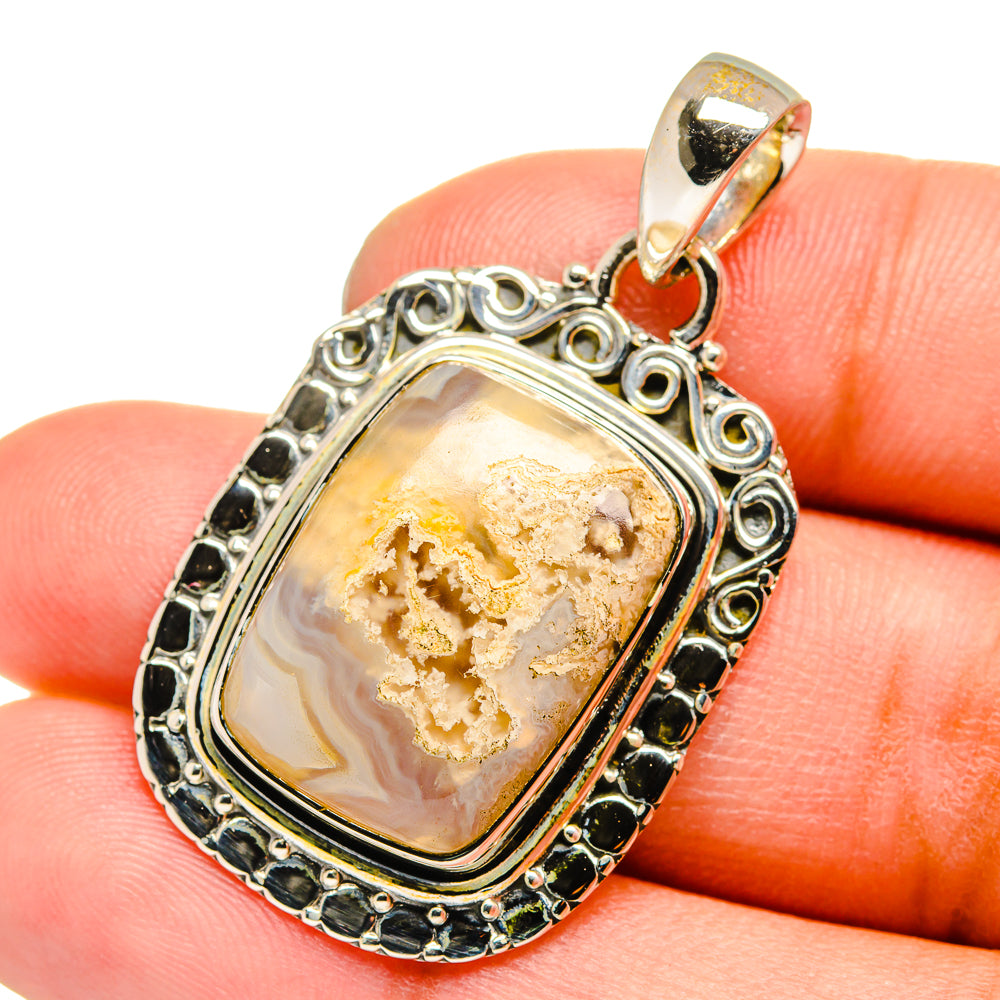 925 sterling silver lace agate pendant with gold-and-cream cabochon and ornate frame.