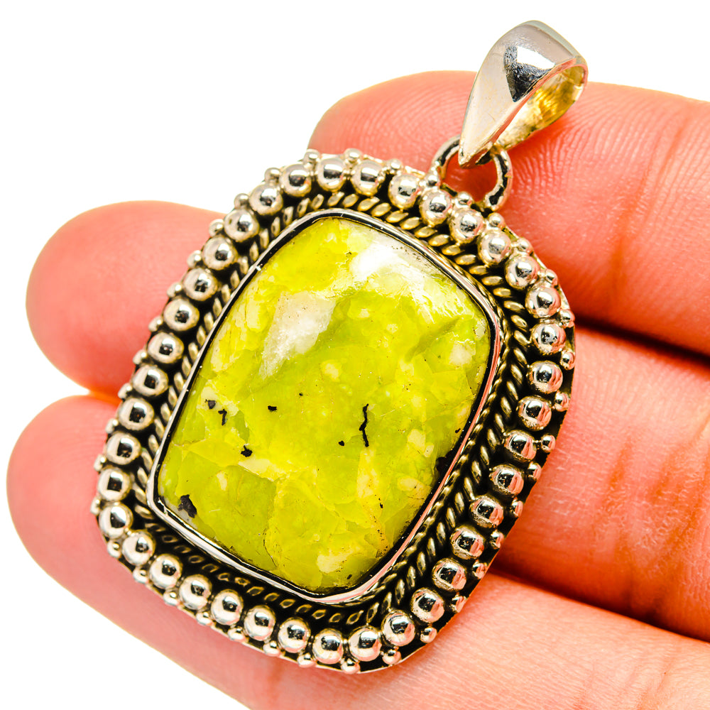 Green opal pendant in ornate sterling silver setting, oval cabochon
