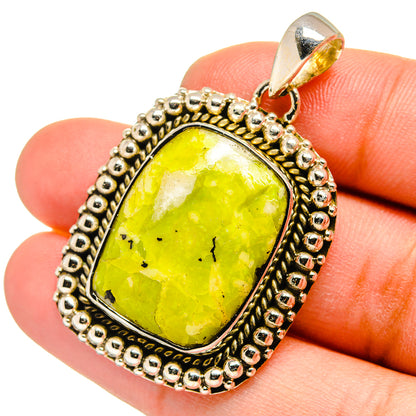 Green opal pendant in ornate sterling silver setting, oval cabochon