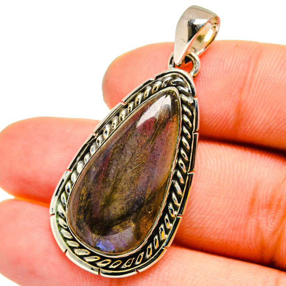925 sterling silver labradorite teardrop pendant with dark stone and rainbow flash