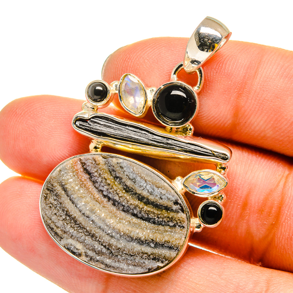 Oval druzy pendant with black onyx, iridescent moonstone, and sterling silver bezel