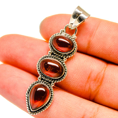 Carnelian sterling silver pendant with three dark orange ovals on bail