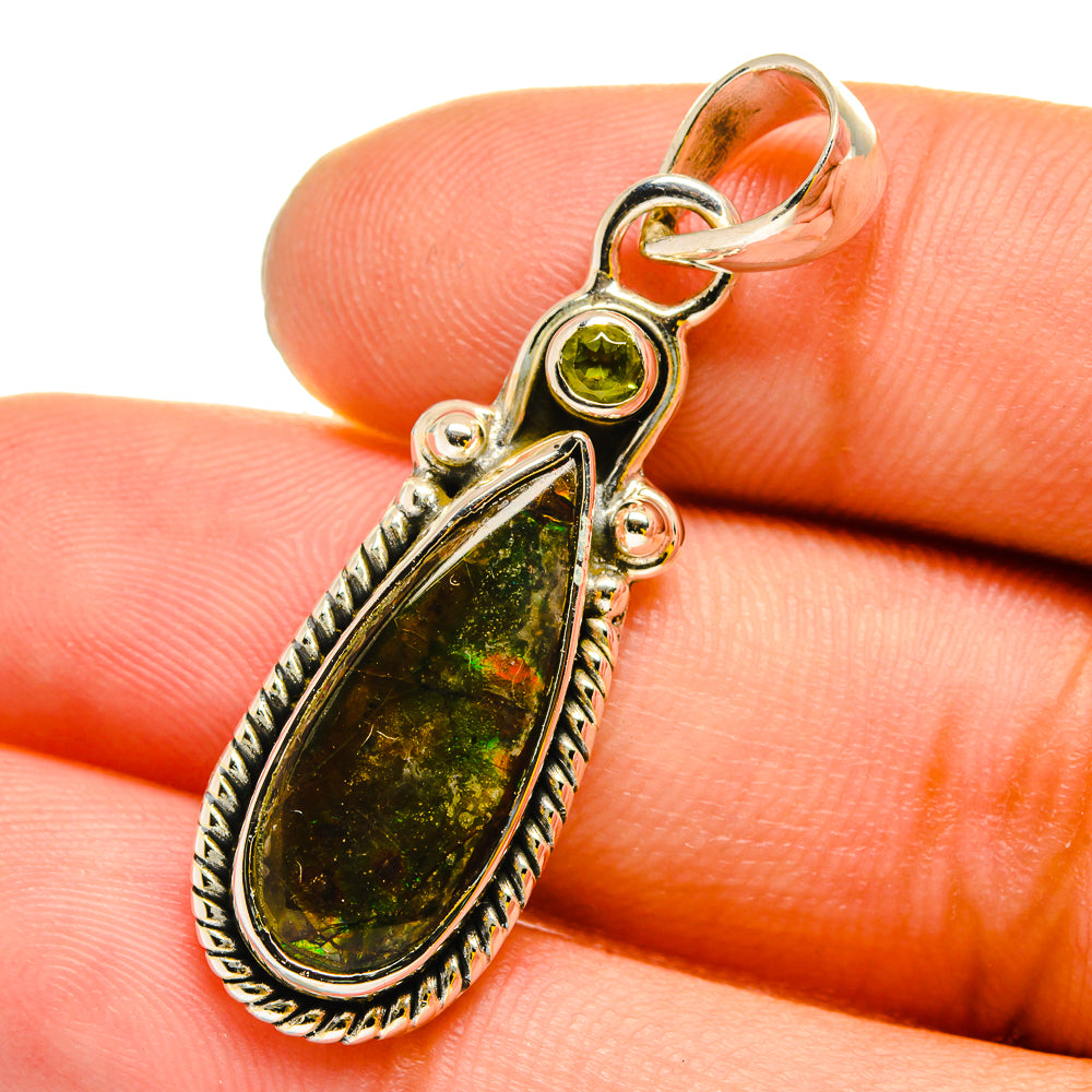 Teardrop ammolite pendant with round peridot and ornate 925 silver border