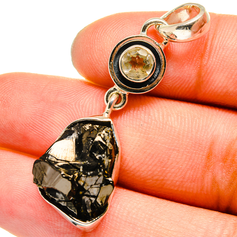 Rough black shungite drop pendant with round yellow quartz set in silver